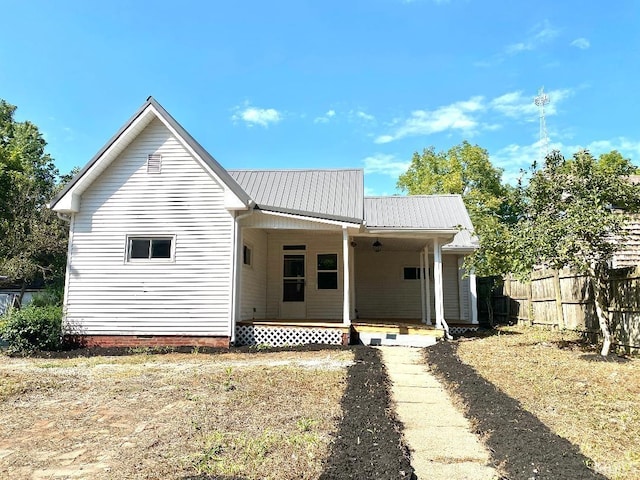 rear view of property featuring a porch