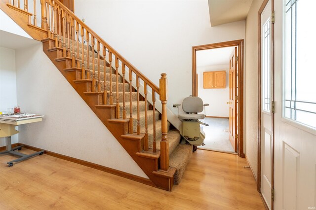 stairs with wood-type flooring