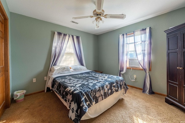 bedroom featuring cooling unit, ceiling fan, and carpet