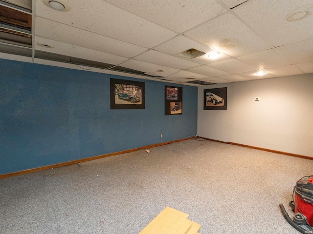 basement with carpet and a drop ceiling