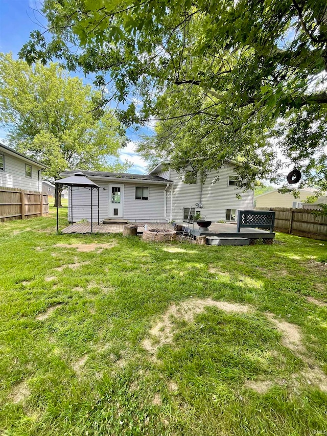 view of yard featuring a wooden deck and a gazebo