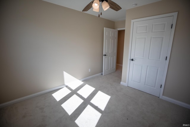 114 Meadow Ct, Argos, IN 46501 - unfurnished bedroom featuring light colored carpet, baseboards, and a ceiling fan