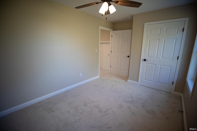 114 Meadow Ct, Argos, IN 46501 - unfurnished bedroom with light carpet, baseboards, and a ceiling fan