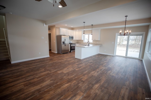 114 Meadow Ct, Argos, IN 46501 - kitchen featuring appliances with stainless steel finishes, open floor plan, a ceiling fan, a sink, and dark wood finished floors