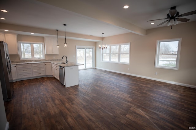114 Meadow Ct, Argos, IN 46501 - kitchen featuring a peninsula, appliances with stainless steel finishes, a sink, dark wood finished floors, and white cabinets