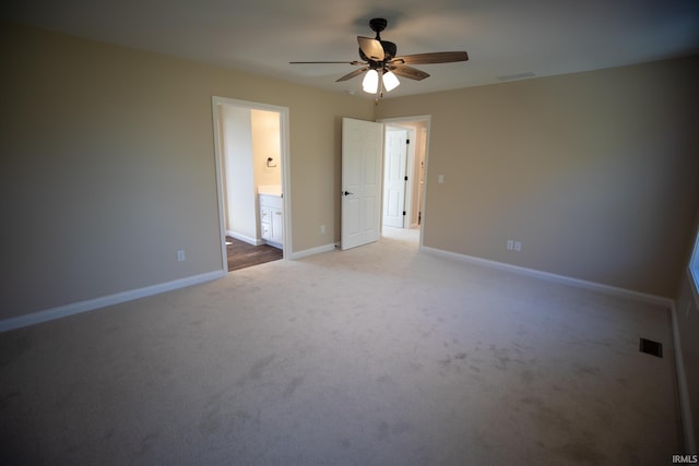 114 Meadow Ct, Argos, IN 46501 - spare room featuring a ceiling fan, light colored carpet, and baseboards