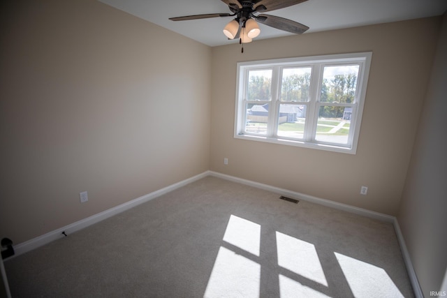 114 Meadow Ct, Argos, IN 46501 - spare room featuring ceiling fan, light colored carpet, and baseboards