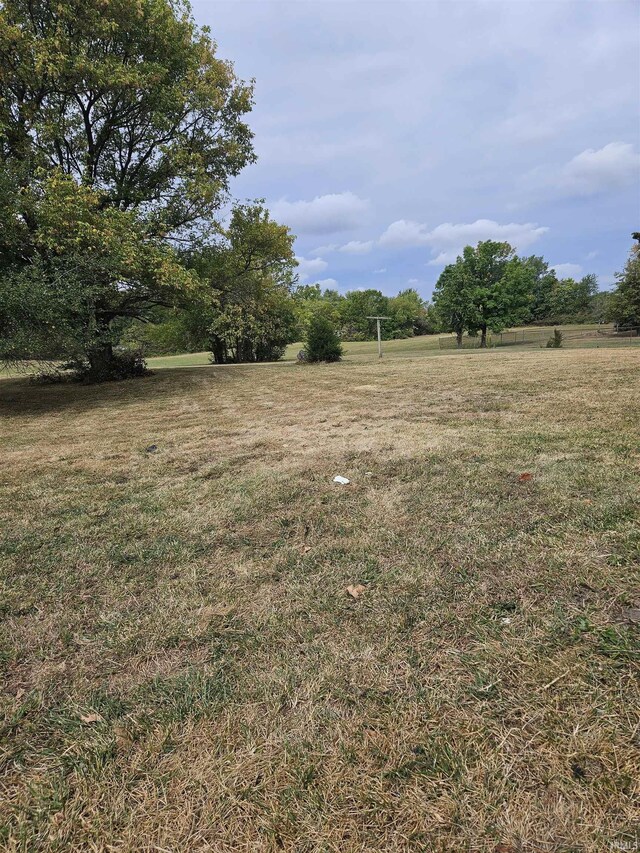 view of yard with a rural view