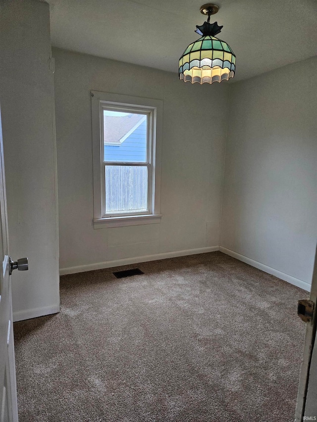 spare room featuring carpet flooring