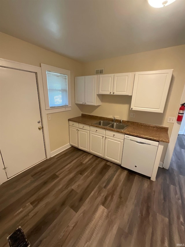 kitchen featuring white dishwasher, sink, dark hardwood / wood-style floors, and white cabinetry