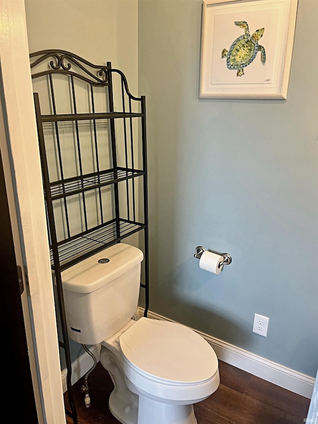 bathroom with wood-type flooring and toilet