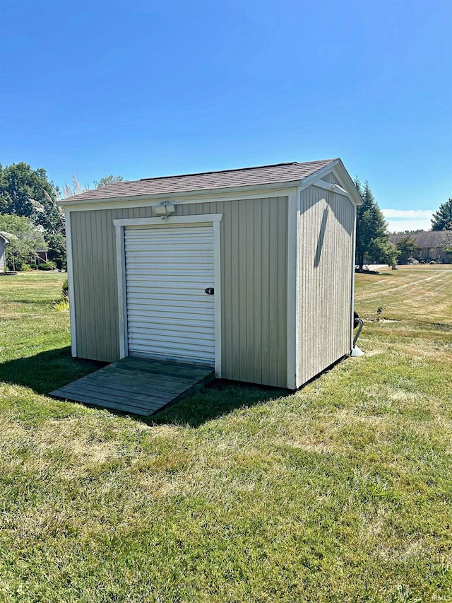 view of outbuilding with a lawn