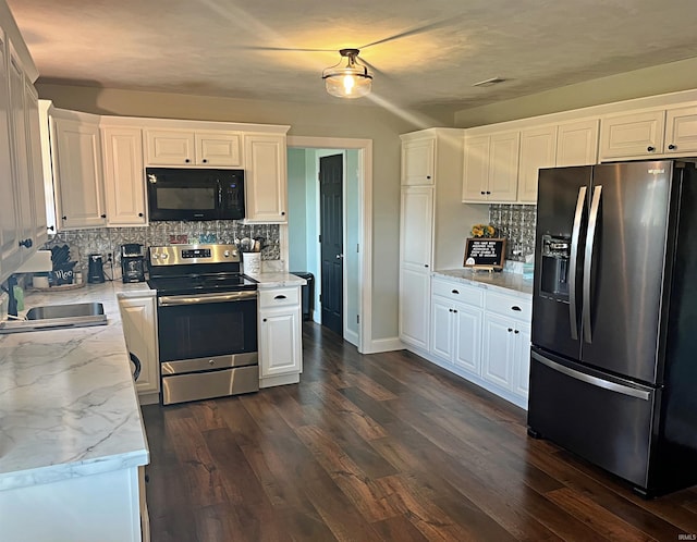 kitchen with stainless steel appliances, dark hardwood / wood-style floors, and white cabinetry