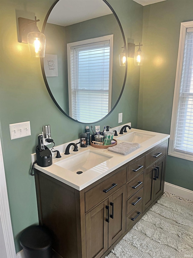 bathroom featuring a wealth of natural light and vanity