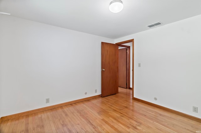 spare room with light wood-type flooring