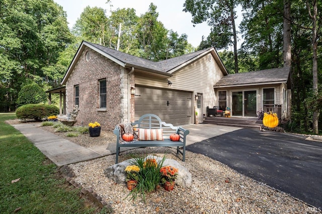 view of side of home featuring a garage