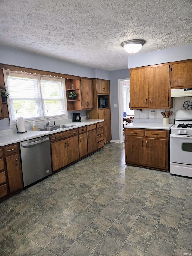 kitchen with a textured ceiling, white range with gas cooktop, stainless steel dishwasher, sink, and black microwave