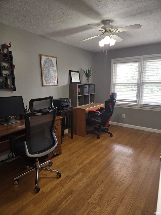 office with a textured ceiling, hardwood / wood-style flooring, and ceiling fan