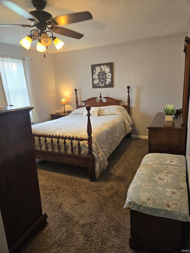 carpeted bedroom with ceiling fan and a textured ceiling