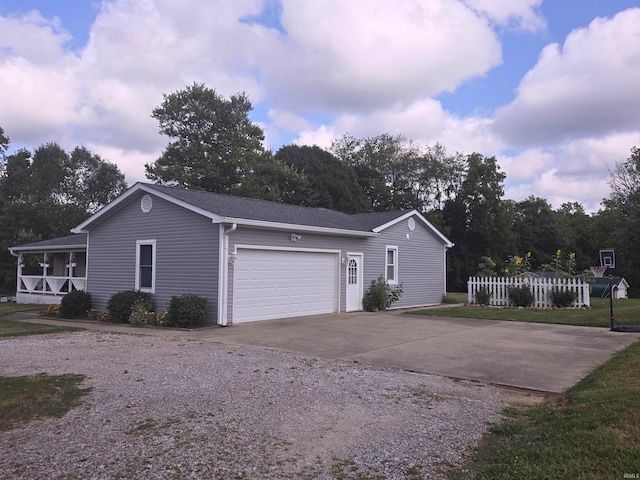 view of front of property with a garage and a front lawn