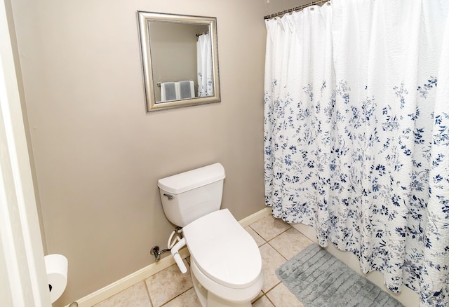 bathroom with tile patterned floors and toilet