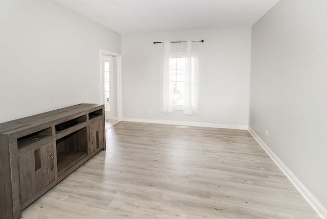 unfurnished room with light hardwood / wood-style flooring