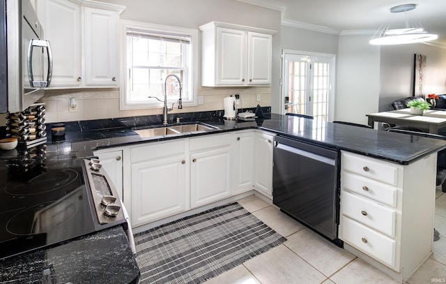 kitchen with stainless steel microwave, ornamental molding, a sink, dishwasher, and a peninsula