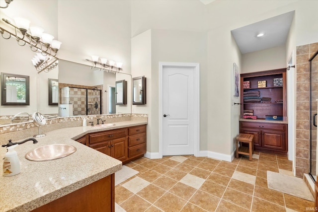 bathroom featuring vanity, walk in shower, and tile patterned flooring