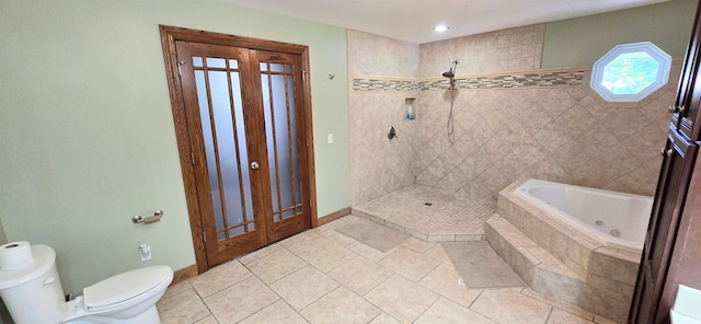 bathroom with toilet, tile patterned floors, and plus walk in shower