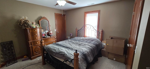 bedroom featuring ceiling fan and light carpet