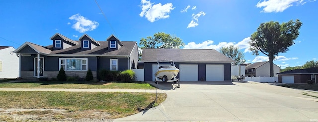 view of front of house with a garage and a front yard