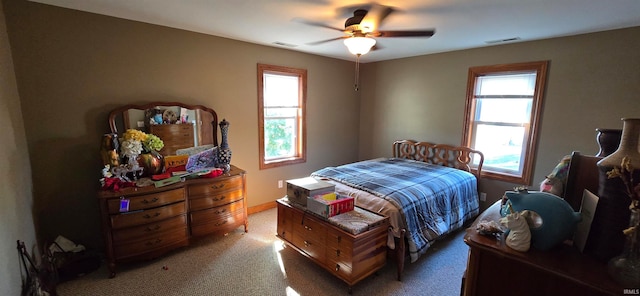 bedroom with ceiling fan and carpet floors