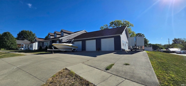 view of front of house with a garage and a front yard