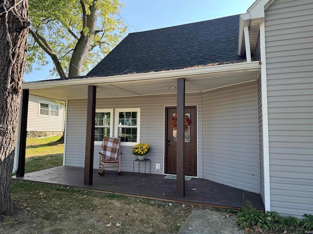 view of exterior entry with covered porch