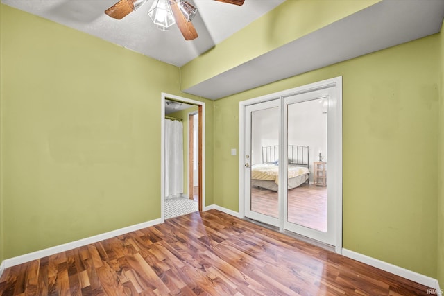 empty room featuring ceiling fan and wood-type flooring