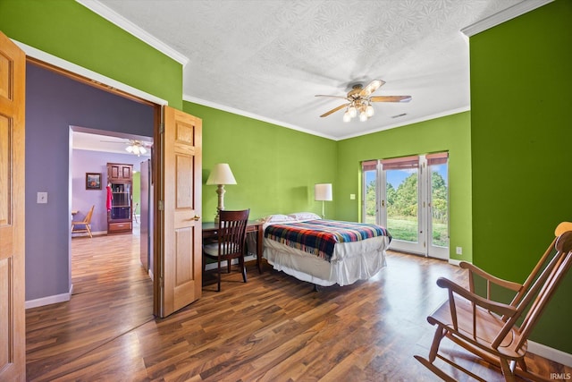 bedroom with dark hardwood / wood-style flooring, access to exterior, ceiling fan, and a textured ceiling