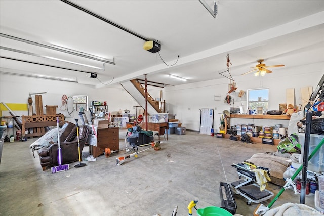 garage with ceiling fan and a garage door opener