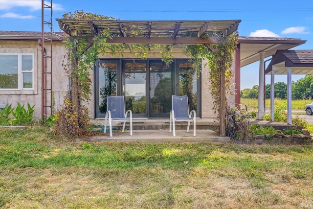 back of house with a yard, a patio, and a pergola