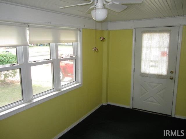 entryway with ceiling fan and a wealth of natural light