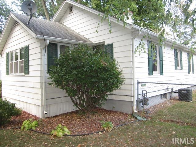 view of property exterior featuring central AC