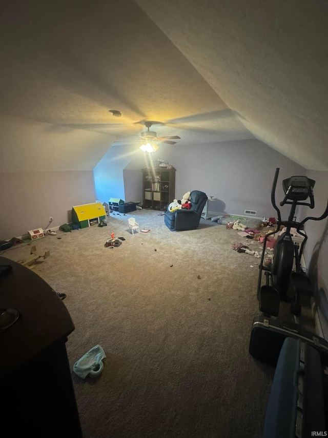 bonus room with carpet flooring, ceiling fan, and vaulted ceiling