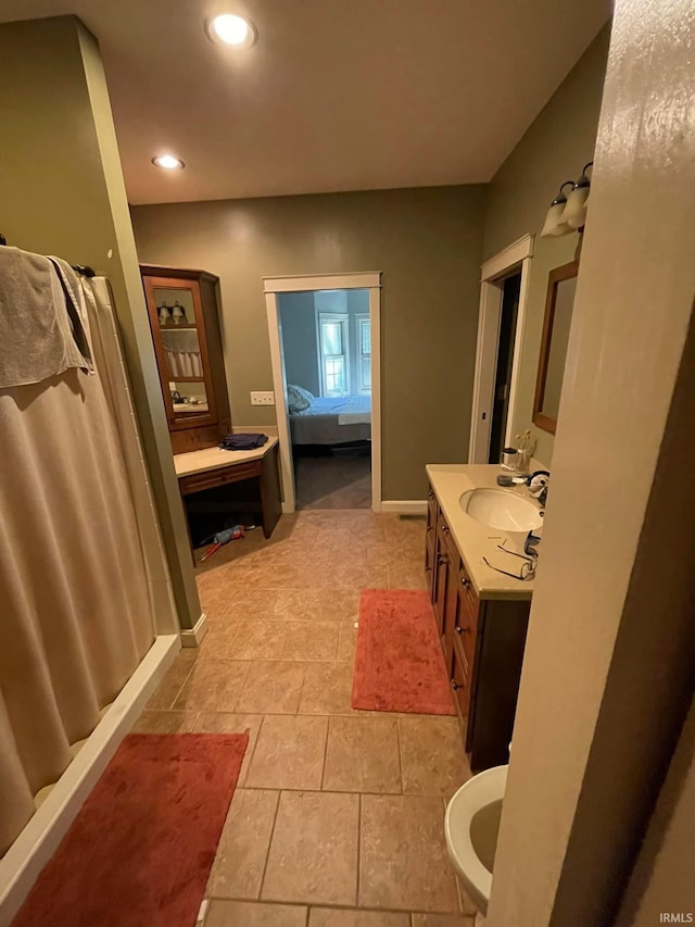 bathroom featuring tile patterned floors and vanity