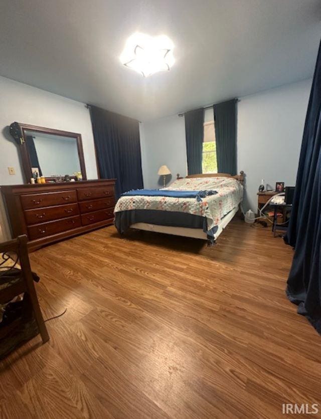 bedroom featuring hardwood / wood-style floors