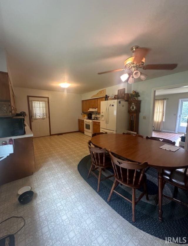 dining space with lofted ceiling and ceiling fan