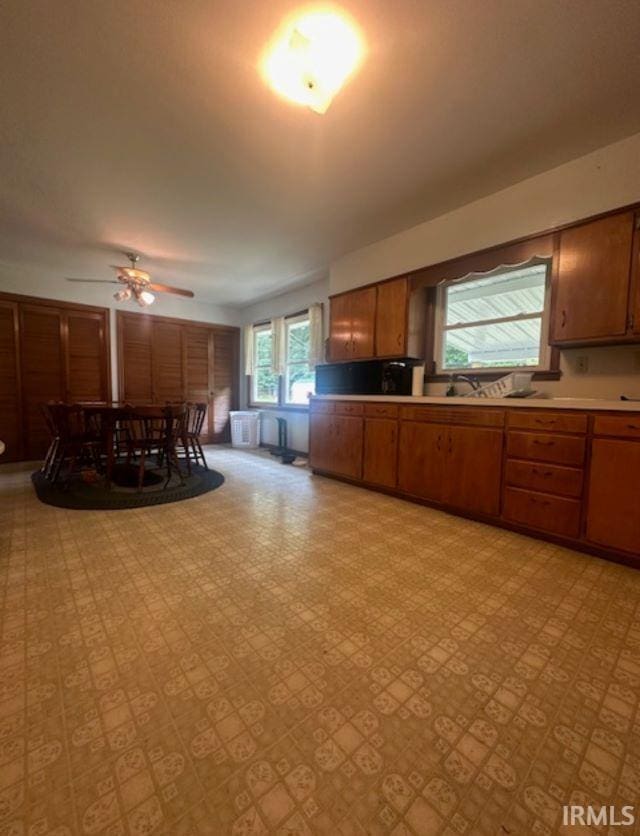 kitchen featuring ceiling fan