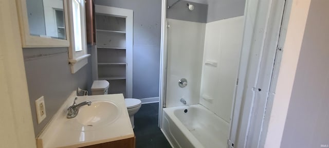 full bathroom with vanity, toilet, and washtub / shower combination