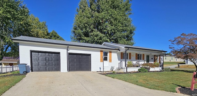 ranch-style house with a garage, a front lawn, and a porch