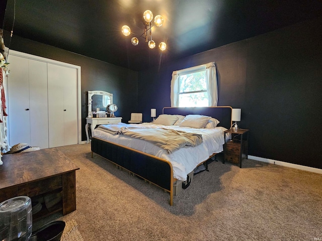 bedroom featuring an inviting chandelier and carpet