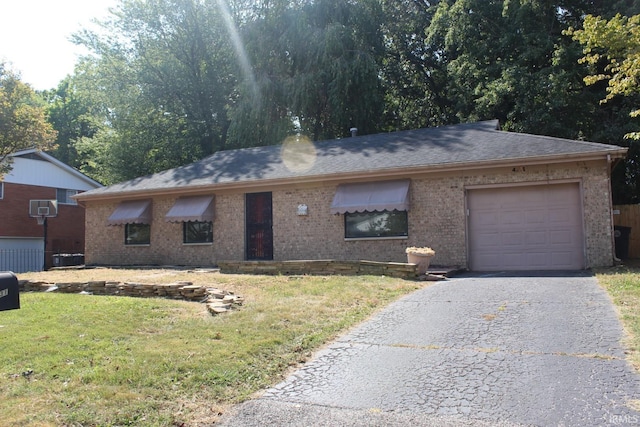 ranch-style home with a garage and a front yard