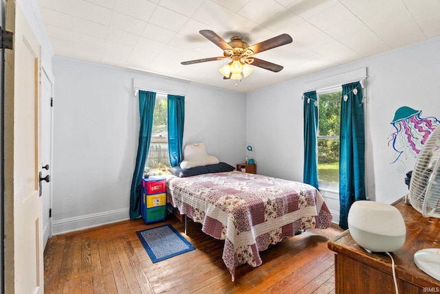 bedroom featuring ceiling fan and wood-type flooring